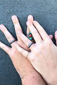 Notice how it only appears to go all the way around the finger… it actually stops on the edges to help preserve the design. 26 Sweet Wedding Ring Tattoo Ideas Tattoo Wedding Rings Ring Tattoos Ring Tattoo Designs