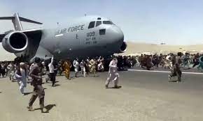Afghan woman in limbo at kabul airport after taliban sweep. Mlydzhvx72icbm