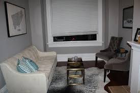 If you're starting fresh, you can introduce colors and other elements from your artwork into rugs, vases, or pillows. Living Room Benjamin Moore Silver Fox