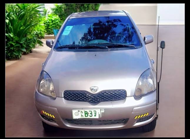 A remarkably clean 2002 Toyota Vitz (XP10) showcasing an unopened engine bay and original body lines., AI generated