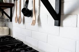 This post is in partnership with lowe's. White Faux Brick Tile Backsplash Clover Lane