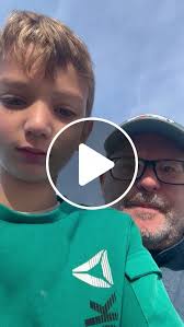 Charles McKenzie and son, Charlie, demonstrate chimpanzee call he learned  from Jane Goodall