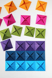 Using the traced letters as a guide, apply nail heads or brass tacks with a hammer or rubber mallet. Easy Origami Wall Art Gathering Beauty