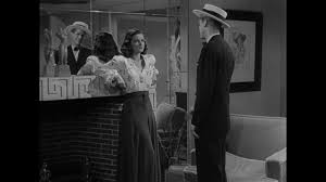 Robinsongiving a college lecture, while behind him the words sigmund freud are written on a blackboard. Film Noir Board The Woman In The Window 1944