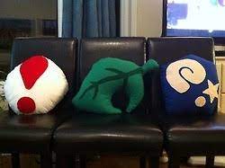 Cool Animal Crossing Pillows A Pitfall Seed A Piece Of Furniture Shaped Like A Leaf And A Fossil Animal Crossing Nerdy Decor Crafts