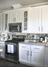 Nothing pairs more perfectly with a modern kitchen than a sleek, white backsplash. Gray And White Kitchen Reveal Grey Countertops Gray And White Kitchen Backsplash For White Cabinets