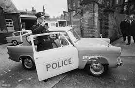 Black And White Police Car Uk Police Officer With A New Ford Anglia 105e Patrol Car 1st March 1967 Picture Id533896723 1024 666 Old Police Cars Police British Police Cars