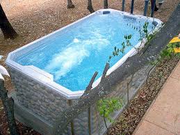 Swim Spa In Rock Above Ground Style Available At Http Www Swimspas Com Swimming Pools Swim Spa Endless Swimming Pool