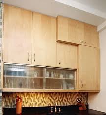 An Example Of Vertical Cabinets Hung Over Horizontal Sliding Cabinets Glass Cabinet Doors Unfinished Kitchen Cabinets Diy Kitchen Cabinets