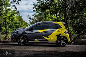 Black And Yellow Camo Car Wrap Check Out This Stunning Honda Brio Wrap It Features Avery Matte Metallic Charcoal And Gloss Yellow Laid Out In A Contrasti Honda Brio Honda Car Sticker Design