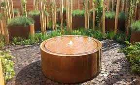 In landscape architecture and garden design, a water feature is one or more items from a range of fountains, jeux d'eau, pools, ponds, rills, artificial waterfalls, and streams. Corten Steel Water Table Outdoor Water Features Taylor Made