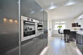 Modern White And Grey Acrylic Kitchen Design With Eye Level Bosch Appliances Des Modern Kitchen Accessories Kitchen Design Decor Integrated Kitchen Appliances