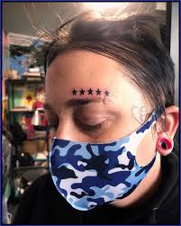 Image result for quirky pylon forehead tattoo