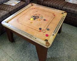 The Carrom Board A Favorite Indoor Game A Reminder Of Countless Summer Vacations Spent Playing This Game With Family Carrom Board Indoor Games Games To Play