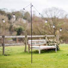 It's made from metal in a black finish, and has an open. Raw Metal Festoon Pole Garden Trading