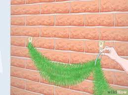 Hanging garland on a mantel is a classic christmas look. 3 Simple Ways To Hang Garland On Brick Wikihow