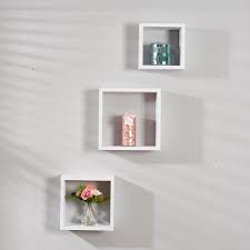 It has a pair of clear glass paneled doors with adjustable shelves concealed behind them. Set Of 3 Wall Cubes