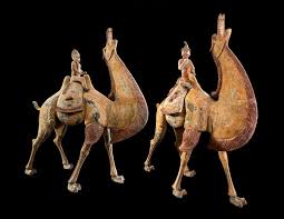 A finely painted pottery figure of a bactrian camel and rider. A Pair Of Tang Dynasty Chinese Terracotta Bactrian Camels With Riders For Sale At 1stdibs