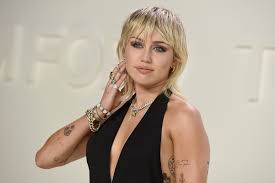 Behold miley cyrus' most iconic looks over the years. Miley Cyrus Is A Cover Queen With Her Take On Britney Spears Los Angeles Times