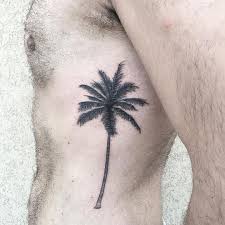 Black Palm Tree Tattoo On The Rib Cage Palm Tree Tattoo Tree Tattoo Tattoos