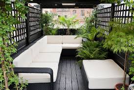 Seating consists of lounge chairs and armchairs made of bamboo. Roof Garden Designs Jm Garden Design