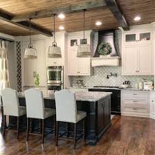 Farmhouse Kitchen With White Cabinets Black Island And Beamed V Groove Pine Plank Ceiling Farmhouse Chic Kitchen Rustic Farmhouse Kitchen Kitchen Renovation