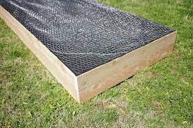 Turn them over and use a scratch awl or a screwdriver and your hammer to poke a few weep holes in the bottom. Make Your Own Raised Garden Bed In 4 Easy Steps A Beautiful Mess