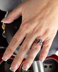 Pin By Beth Tapia On I Want To Do This Ring Tattoo Designs Wedding Ring Tattoo Tattoo Wedding Rings