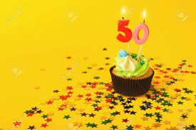 Free cupcake boxes mockup psd for 4 cupcakes box and 1 cupcake box carefull laid on a clear and customizable background. 50th Birthday Cupcake With Candle And Sprinkles On Yellow Background Stock Photo Picture And Royalty Free Image Image 97254102