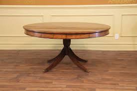 Assessing the style of a piece of furniture, such as a dining table, can help determine not only its age, but also from which part of the world it originated. Round Adams Style Antique Reproduction Pedestal Dining Table