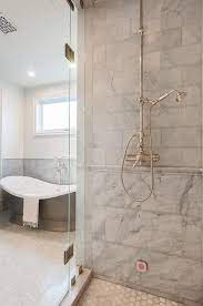 Also, it can hide the lines when the tile ends and paint begins. Mixed Gray Marble Shower Tiles With Marble Chair Rail Tiles Transitional Bathroom