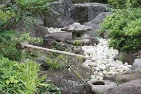 You can also add an extra layer of pea gravel on top to make the plants appear like they're growing. How To Make A Rock Garden Purple Flower