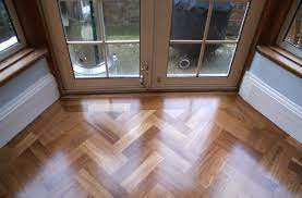 There's flooring, and there's being floored. Istoria Bespoke Solid Iroko Parquet Blocks Installed In Double Herringbone Patte Home Office London By Istoria By Jordan Andrews Houzz