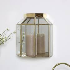 Wall candle sconces are an easy and stylish was to add glow and sophistication to any room in your home. Gold Mirrored Glass Wall Candle Lantern