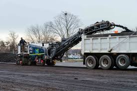 The cold milling machine removed the existing surface course before paving operations