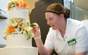 My wedding cake (publix) flowers are fake & were arranged by me. Publix Stephanie Puts The Finishing Touches On A Wedding Cake In Our Bakery Department Facebook