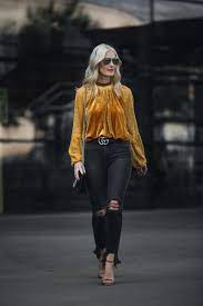 This lush modern black velvet sofa features a gold base, perfect for upping your glam factor—and at only $1,369, too. Velvet Top Free People Gold Velvet Shirt Shopbop Sale