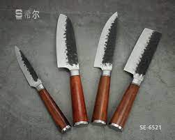 The second full tang handle has moose antler scales. China Hand Forged Hammered Pattern Knife Janpanese Style Kitchen Knife Set With Rosewood Handle Se 6521 China Janpanese Knife And Kitchen Knife Set Price
