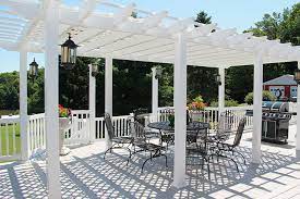 A freestanding pergola creates a defined space that can be located anywhere shade is needed to shelter an outdoor living area, grill setup, cocktail bar, or in the above case, even an oversized outdoor chess set. Pergola Ideas Attached And Free Standing Garbrella Pergolas