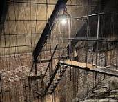 Stairs to props and costume storage in a theater.
