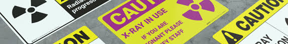 Changes in bowel or bladder habits; X Ray Warning Caution Signs Creative Safety Supply