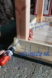 Attach Legs Of Farmhouse Table Featured On Remodelaholic Com Build A Farmhouse Table Farmhouse Table Small Farmhouse Table