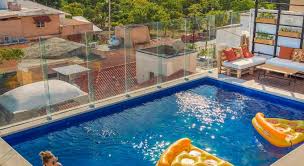 A pool with adequate depth (0.80 m) for the safety of children, with drawings and water fungus in the center. Nomads Hotel Rooftop Pool Cancun Mexico 2021 Reviews Pictures Deals
