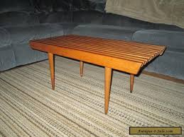 It stands 16 high on its 4 tapered legs w/brass tipped feet, and is 18 across. Vintage 36 Mid Century Danish Modern Slat Bench Coffee Table Stand Real Nice For Sale In United States