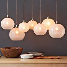 Let this gleaming orb float. Glass Orb Chandelier Opal