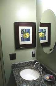 I purchased 2 white recessed shelves to replace the standard mirrored medicine cabinets in my condo bathrooms. The Concealed Cabinet A Recessed Mirrorless Medicine Cabinet Hidden Behind A Picture Frame Recessed Medicine Cabinet Medicine Cabinet Mirror Old Door Decor