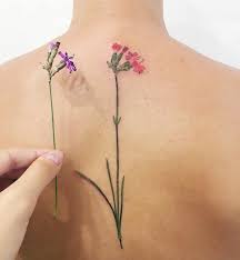 It looks like the flower is on fire and it's stunning. 1001 Ideas For Beautiful Flower Tattoos And Their Secret Meaning