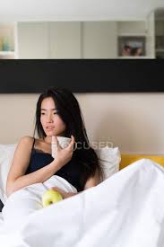 10 ways to wake up beautiful. Chinese Young And Beautiful Woman Waking Up In The Morning And Having Breakfast In Bed Millennial Copy Space Stock Photo 214306944