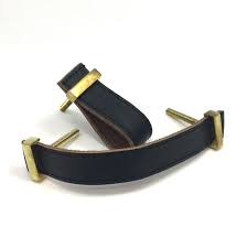 Finger leather drawer pulls are commonly fashioned by looping the leather piece and placing a pin or a rivet through the two ends. Black Faux Leather Drawer Pull Shop For Cabinet Hardware