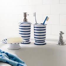 Capture the essence of spring with blooming floral prints and butterflies. Nautical Bathroom Accessories In Blue And White Coastal Decor Ideas Interior Design Diy Shopping